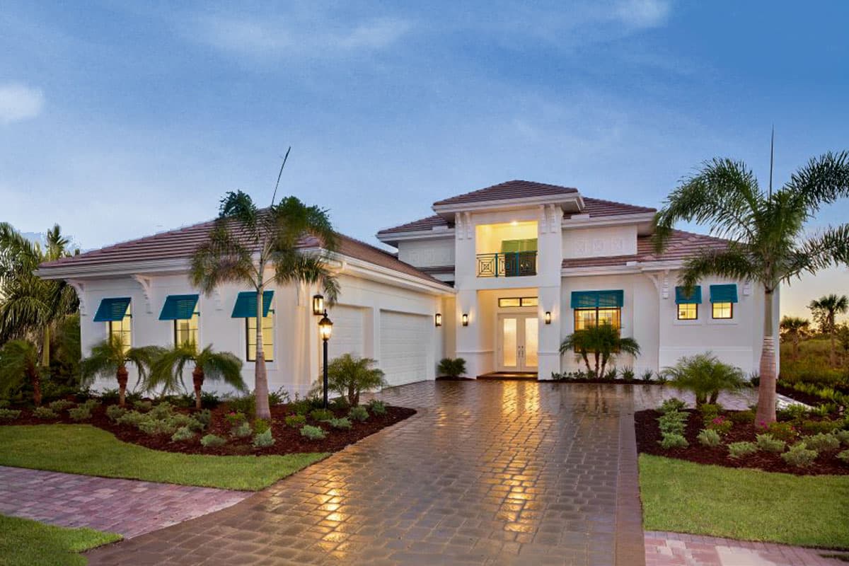 Two-story Modern house plan exterior with a stucco finish, tile roof, two-car garage, and a second-story balcony.