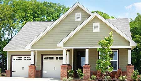 House plan exterior: One-story Modern Farmhouse with double garage, gabled dormers, brick accents, and covered porch supported by columns.