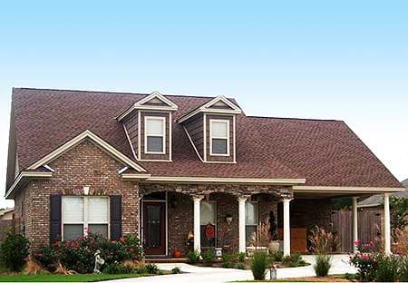 House plan exterior: One-story brick home with gable dormers, covered porch with columns, and attached carport.