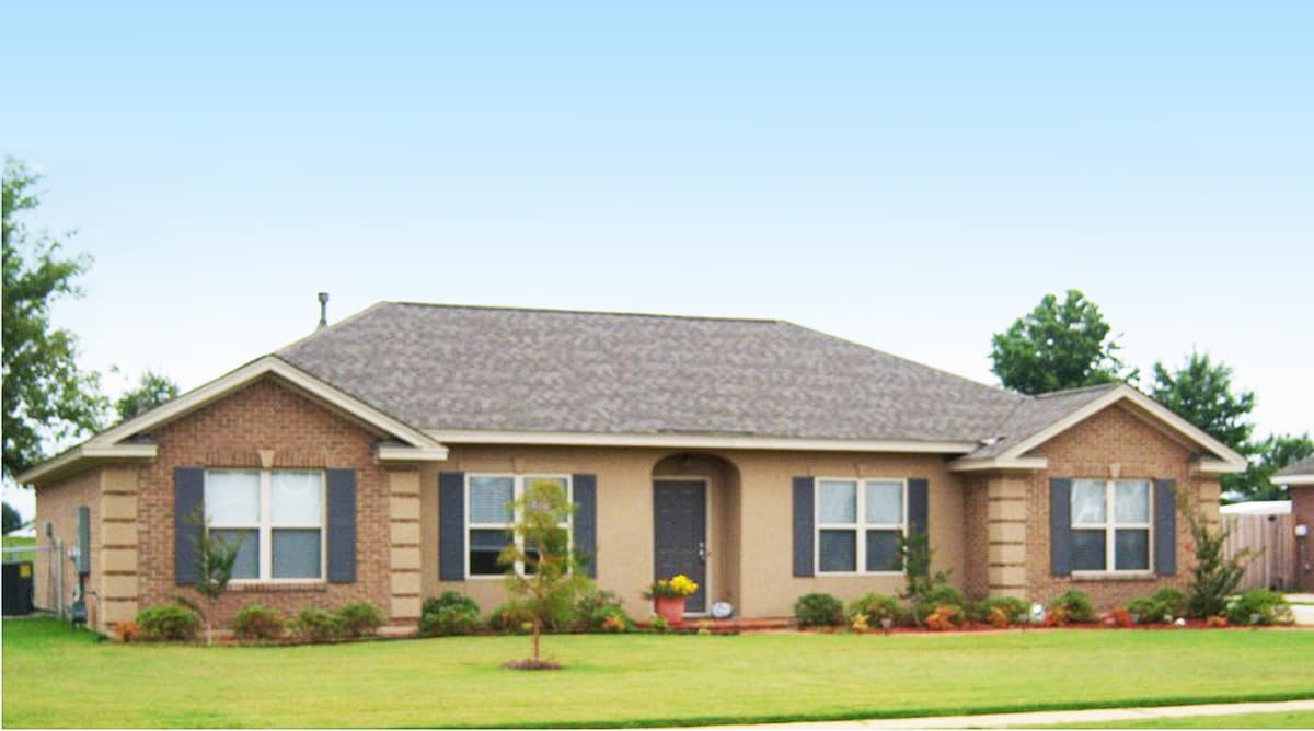 House plan exterior: single-story home with brick accents, arched entryway, dual gables, and prominent rooflines.