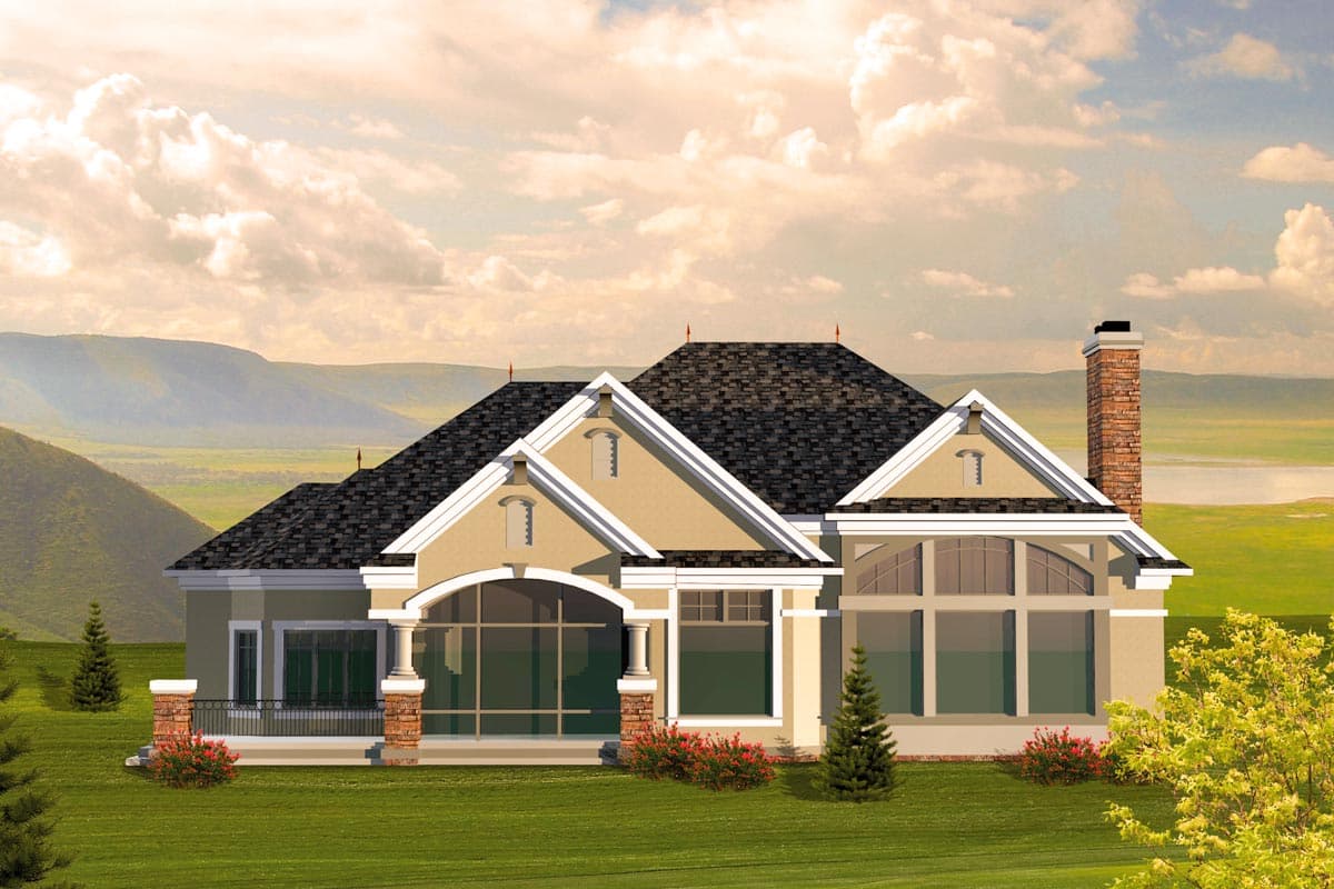 House plan exterior: One-story home with multiple gables, arched windows, a covered porch, and a brick chimney.