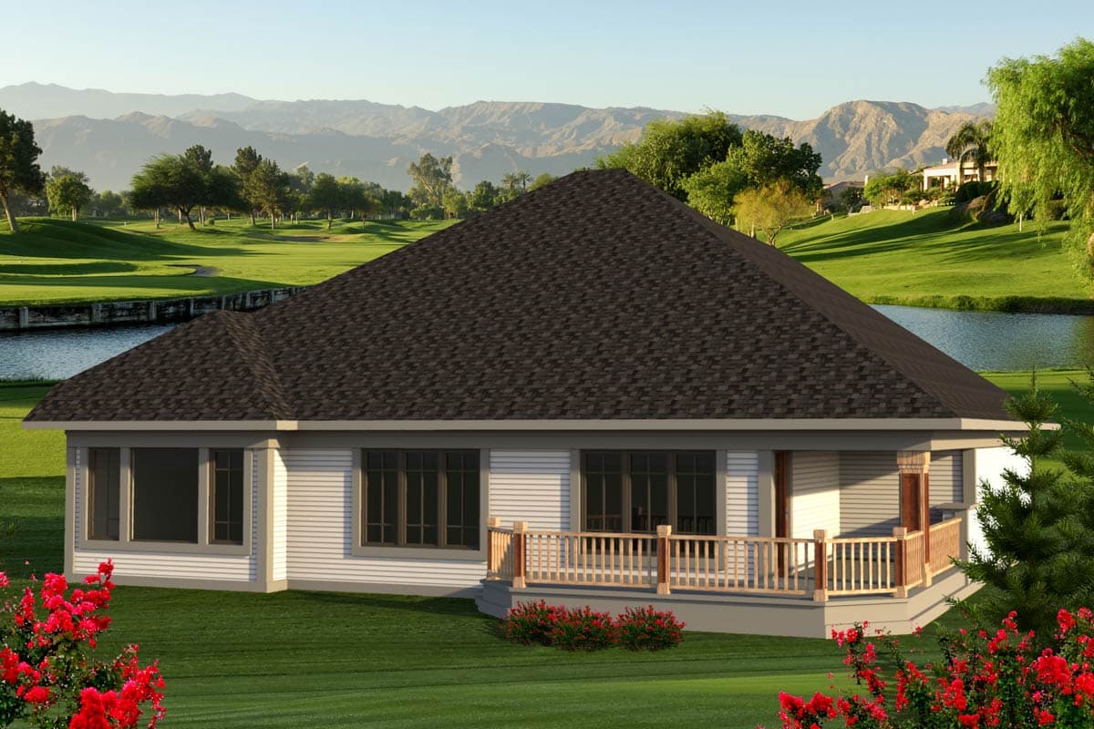House plan exterior: Single-story home with a prominent hip roof, multiple large windows, and a wraparound porch with wooden railings.