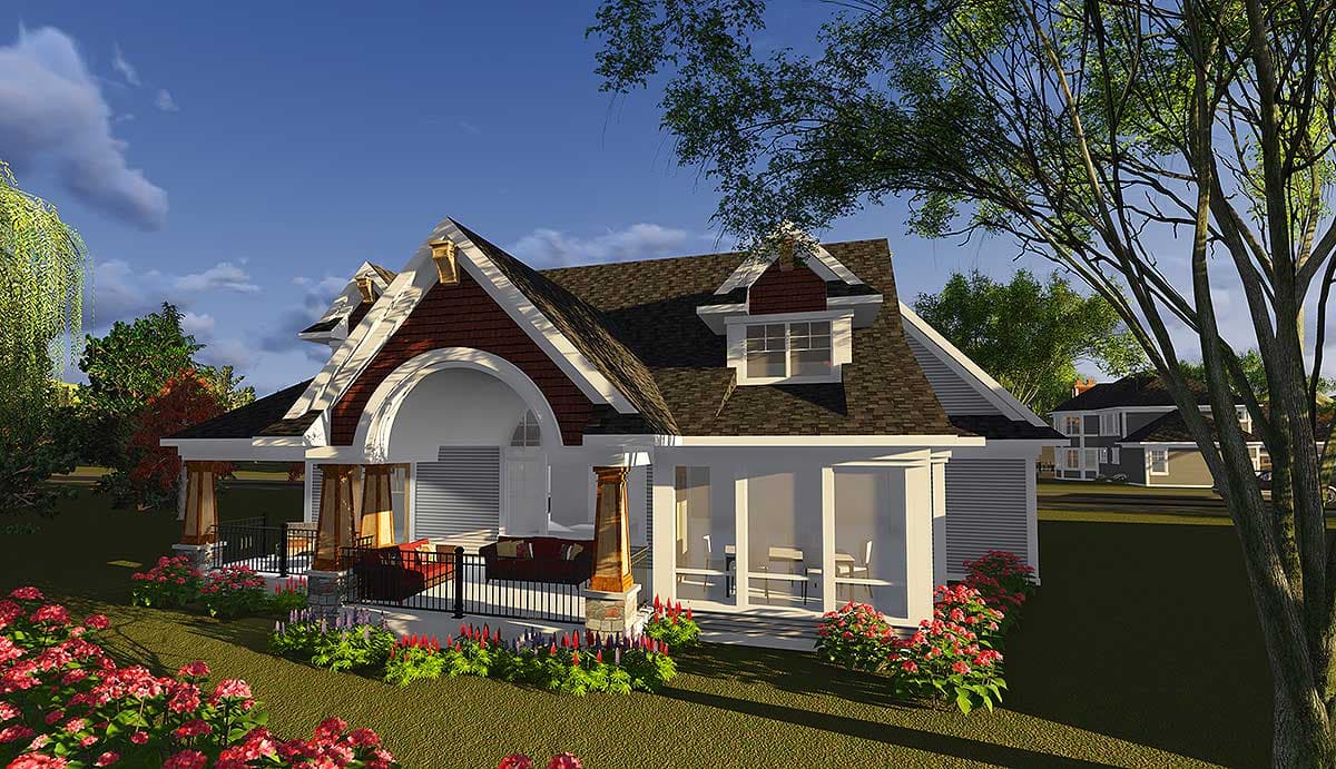 House plan exterior. This two-story home features a wraparound porch, dormers, and a prominent arched entryway.