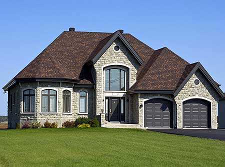House plan exterior: Two-story stone home with arched windows, prominent gables, and a side-facing double garage.