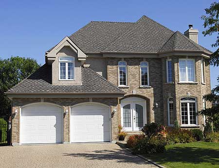 Two-story house plan exterior with a dual garage, arched entry, and dormer.