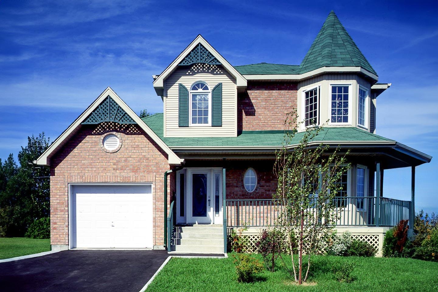 House plan exterior: Two-story home with brick facade, gabled dormers, arched window, and turreted bay window.