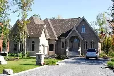 One-level European House Plan with High Pitched Roof