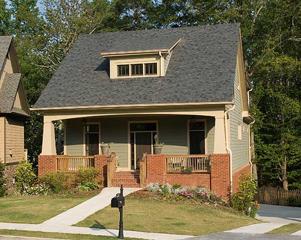 House plan exterior: Two-story Craftsman style home with prominent front porch, dormer window, and brick base.