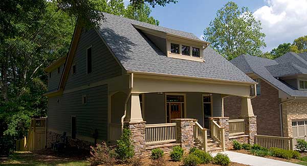 House plan exterior: Two-story home with front porch, stone accents, dormer, and prominent gables.