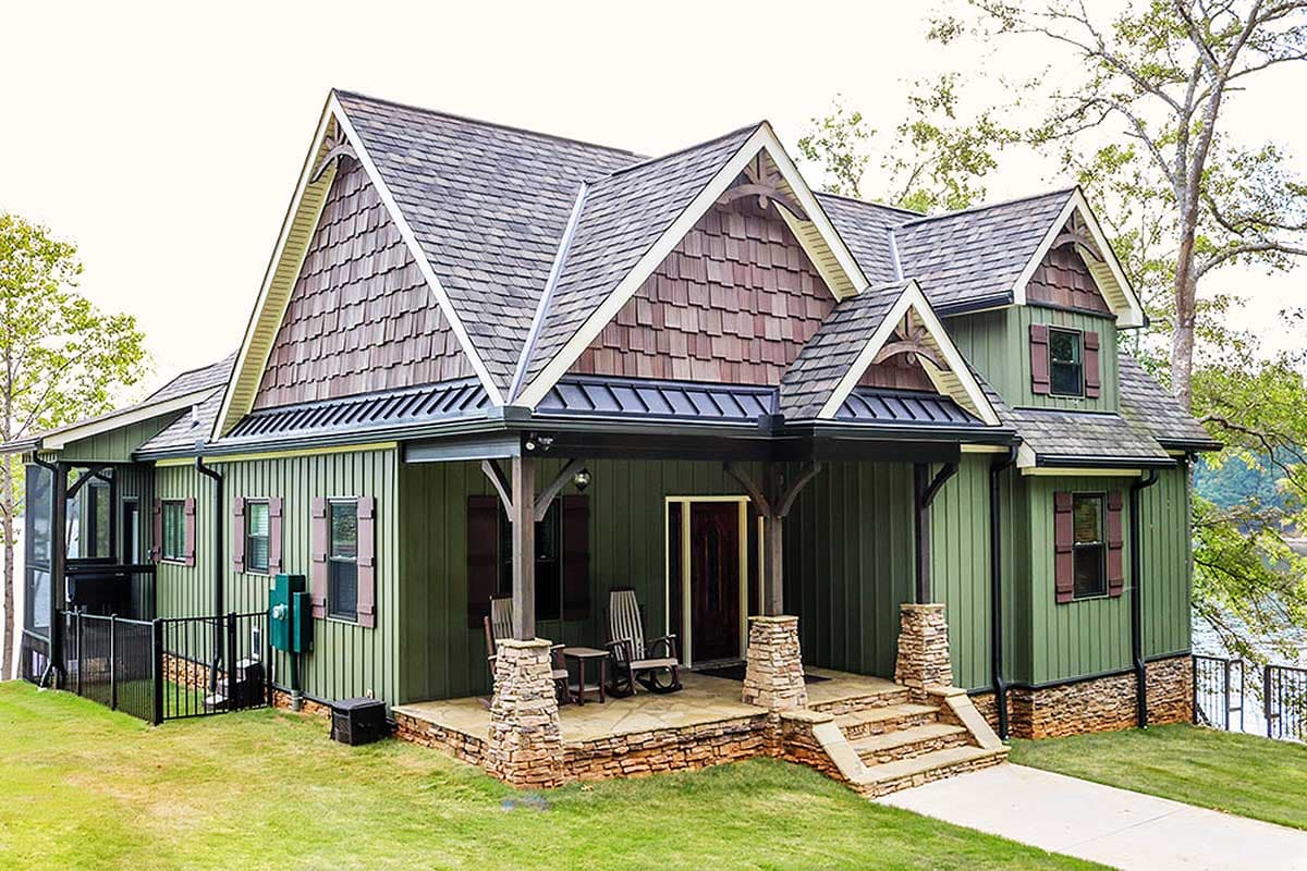 House plan exterior of a two-story Modern Farmhouse with gables, wood shingles, a covered porch with stone pillars, and board-and-batten siding.