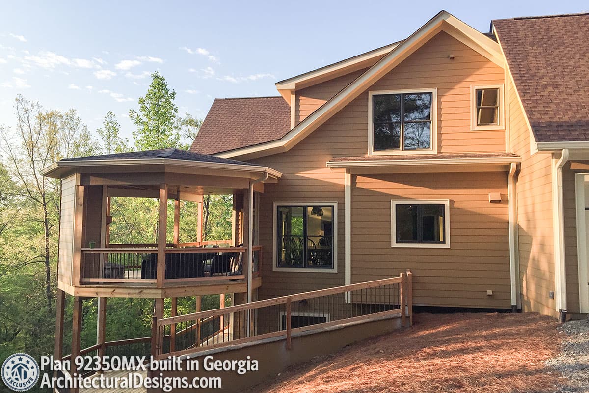 House plan exterior with covered deck, multiple gables, and varied window styles. Built in Georgia.