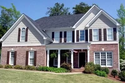Traditional Home Plan with 2-Story Fireplace Wall