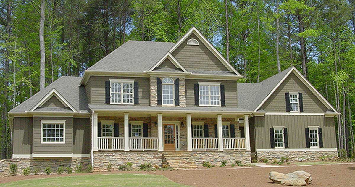 House plan exterior: Two-story Modern Farmhouse with wraparound porch, stone foundation, gables, and dormers.