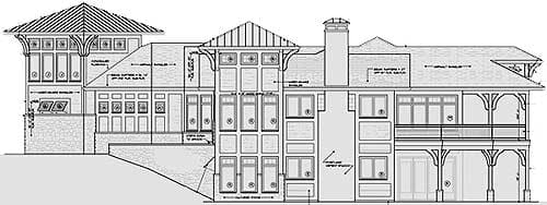 Architectural elevation drawing of a multi-story house plan showing a prominent roof, chimney, multiple windows, and covered balconies.