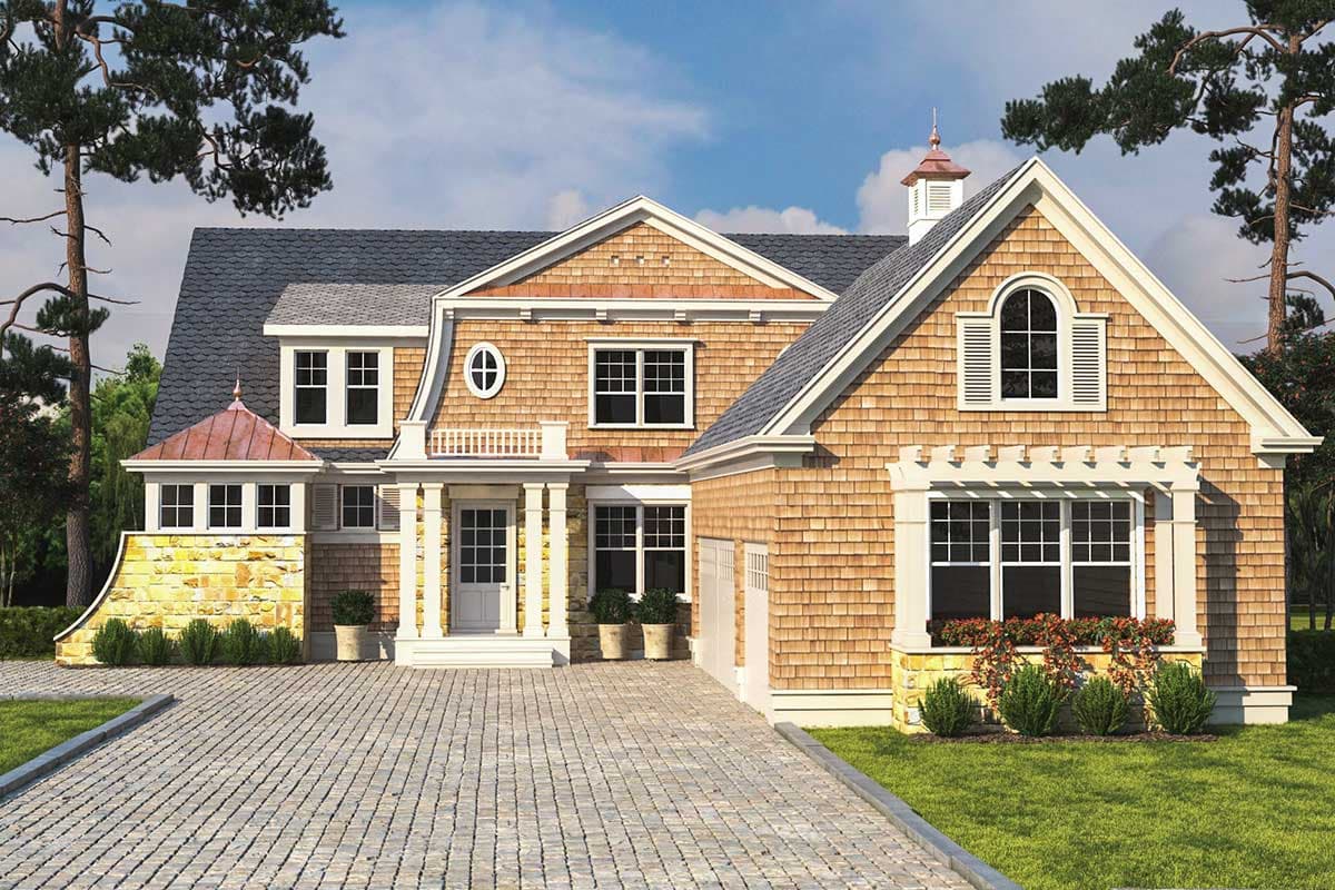 House plan exterior with cedar shingles, stone base, arched dormer, and covered entrance with columns.