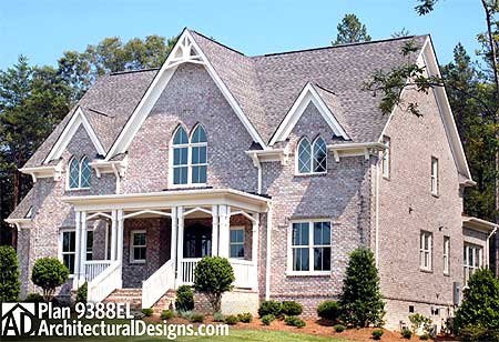 House plan exterior of a two-story brick home with a covered front porch, multiple gables, and arched upper windows.