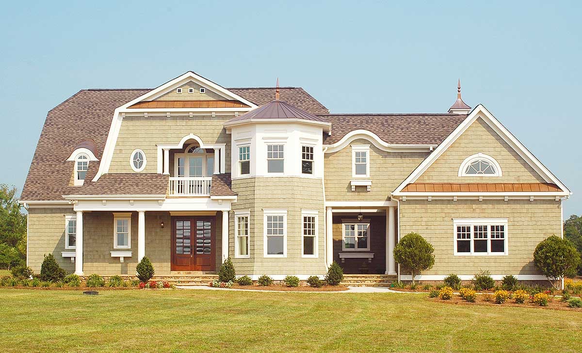 House plan exterior with a hip roof, dormers, bay window, covered entry, and balcony.