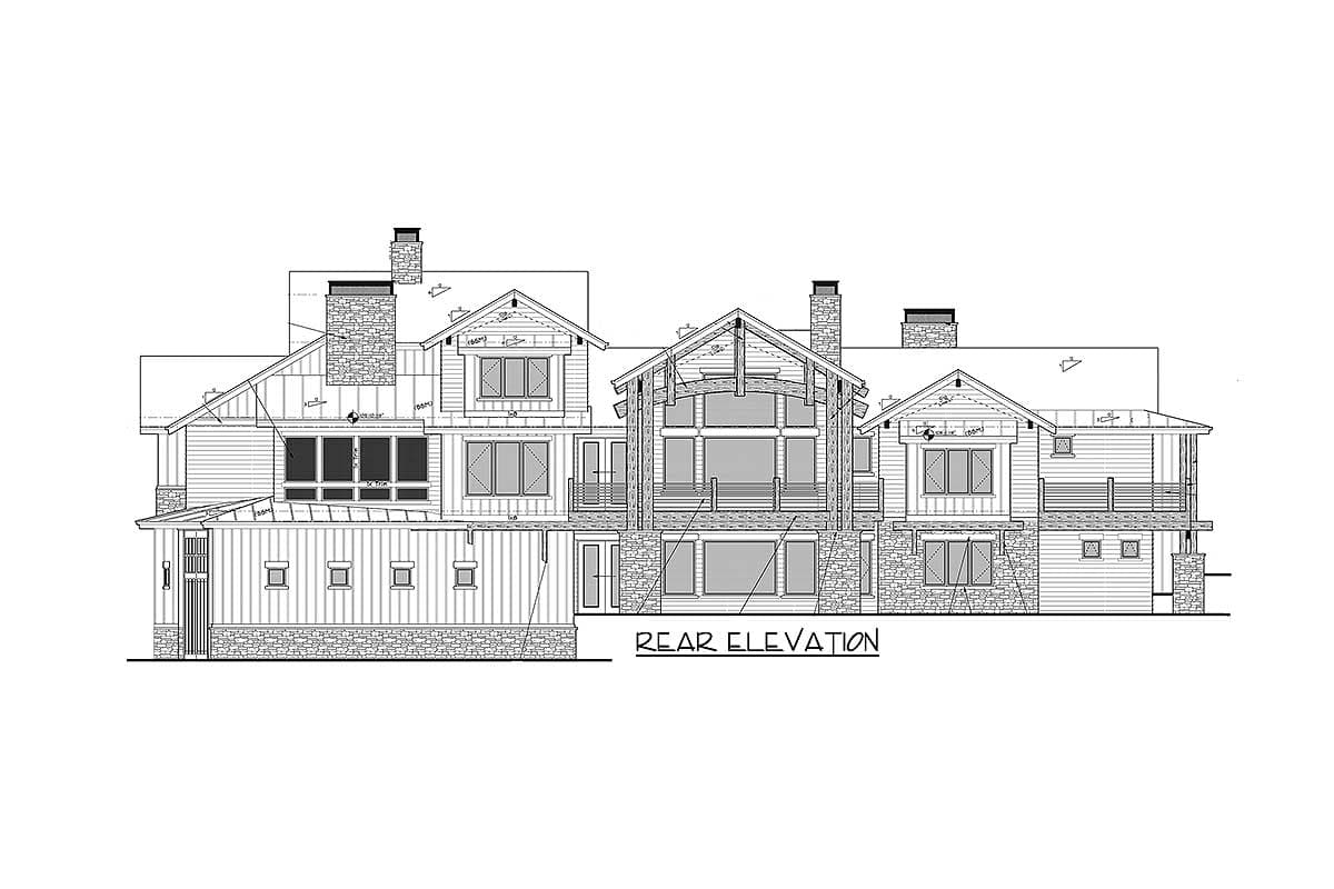 Rear elevation drawing of a multi-story house plan featuring stone accents, prominent gables, and multiple windows.