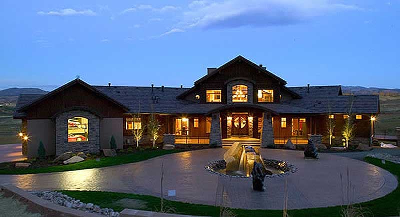House plan exterior: Modern rustic style, one story, stone accents, covered porch with stone columns, and prominent gables.