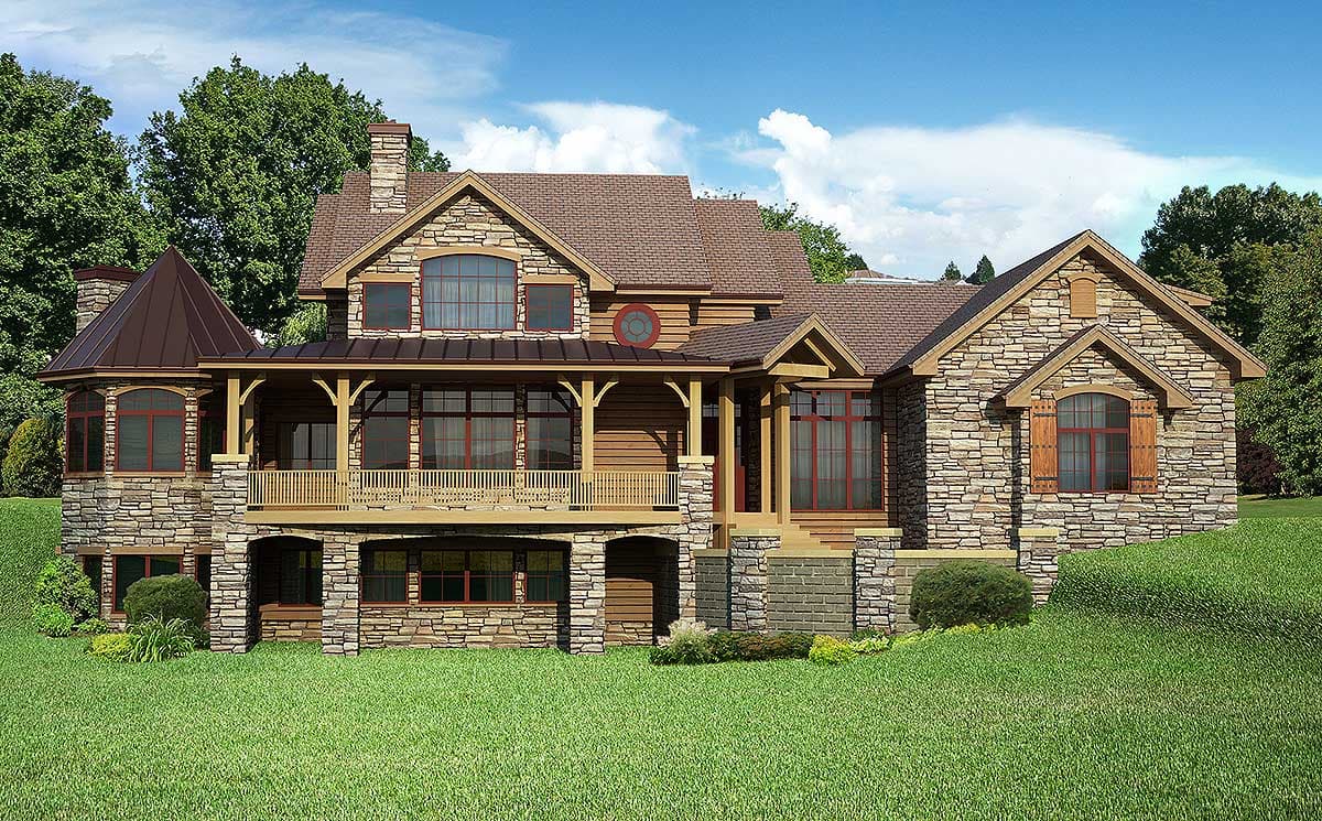 House plan exterior showing a multi-story stone and wood home with a wraparound porch, multiple gables, and a conical turret.