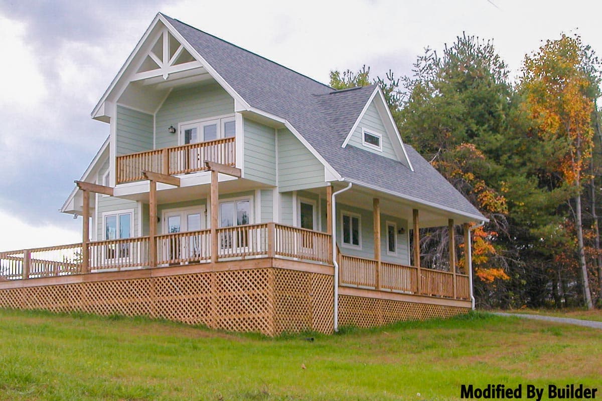 House plan exterior: Two-story dwelling with multiple decks, covered porch, gable roof, and prominent A-frame gable detail.