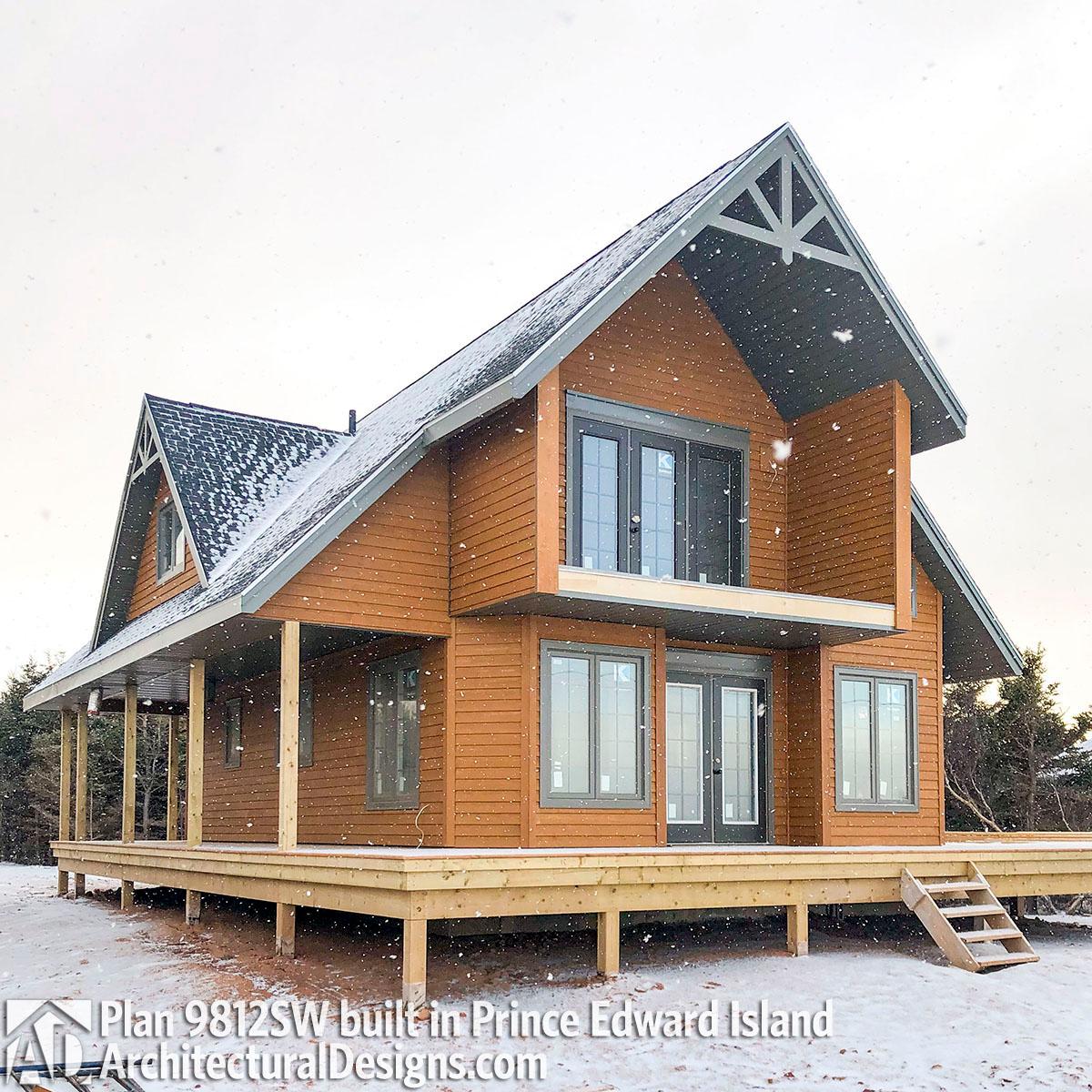 House plan exterior: Modern A-frame design with wraparound porch, double-story balcony, and prominent gables.